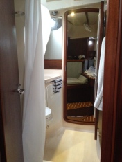 Pass-Through Shower and Head, view from the navigation station on the starboard side of the main salon